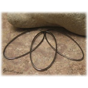 Stor sluten oval 20-pack hematitsvart ca 40x20 mm