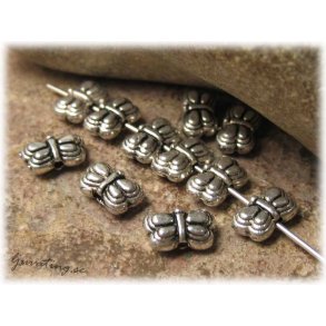 Berlock fjril mellandel i tibetsilver 30-pack ca 8x5 mm