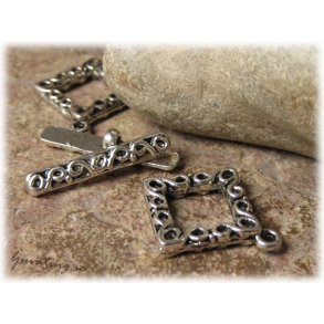 Toggle ls med mnster i metall  ca 24x20 mm