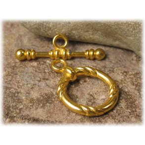 Stort toggle ls guldfrgat ca 21 mm i diameter