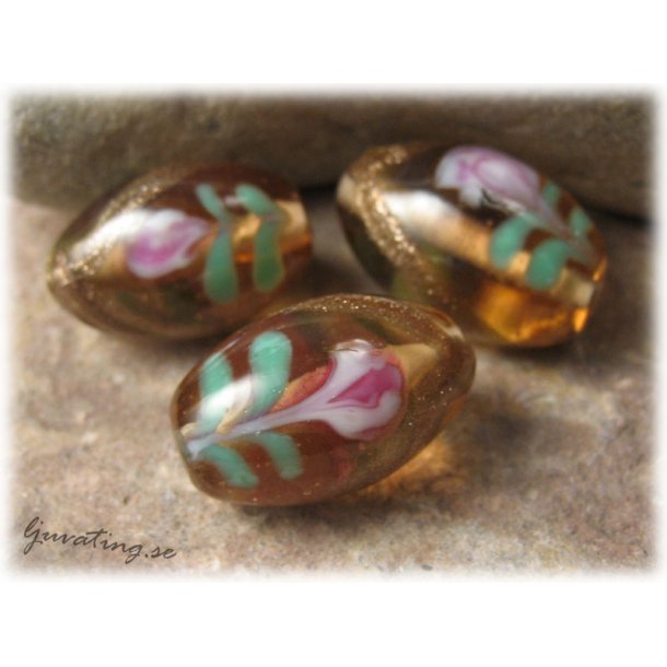 Nougat oval med ros o blad ca 20x13 mm