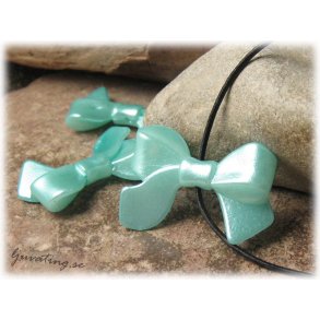 Rosett turkos i syntetmaterial ca 33x23 mm