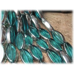 Stor turkos ellips med silverkant ca 30x13 mm