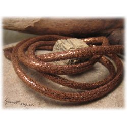 Lderimitation mjuk kopparbrun glittrig med sm ca 5 mm