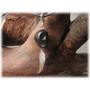 Hnge svart dskalle med vinge och klols